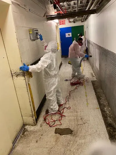 Restoration crew extracting standing water from a flooded Mahwah, NJ home