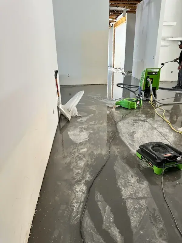 Water leaking from a failed appliance supply line onto a Mahwah, NJ floor