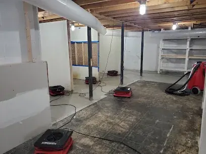 Flooded finished basement being pumped out in Mahwah, NJ