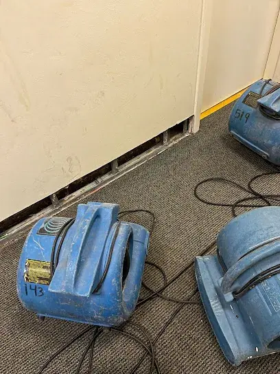 Air movers and dehumidifiers drying a room in a Mahwah, NJ home